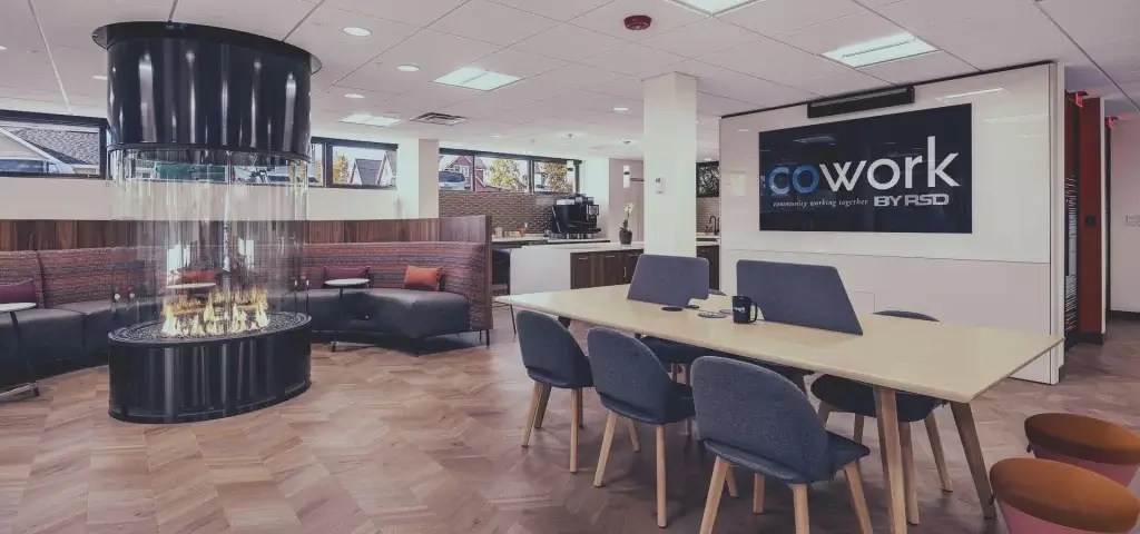 Fire Floor including fireplace, custom circular bench, desk with chairs and large sign with logo
